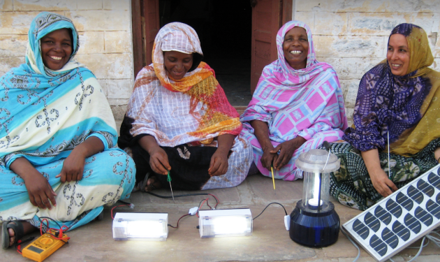 Women with solar panels from Under-Told Stories site