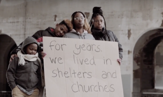 Family holding sign from Aeon site